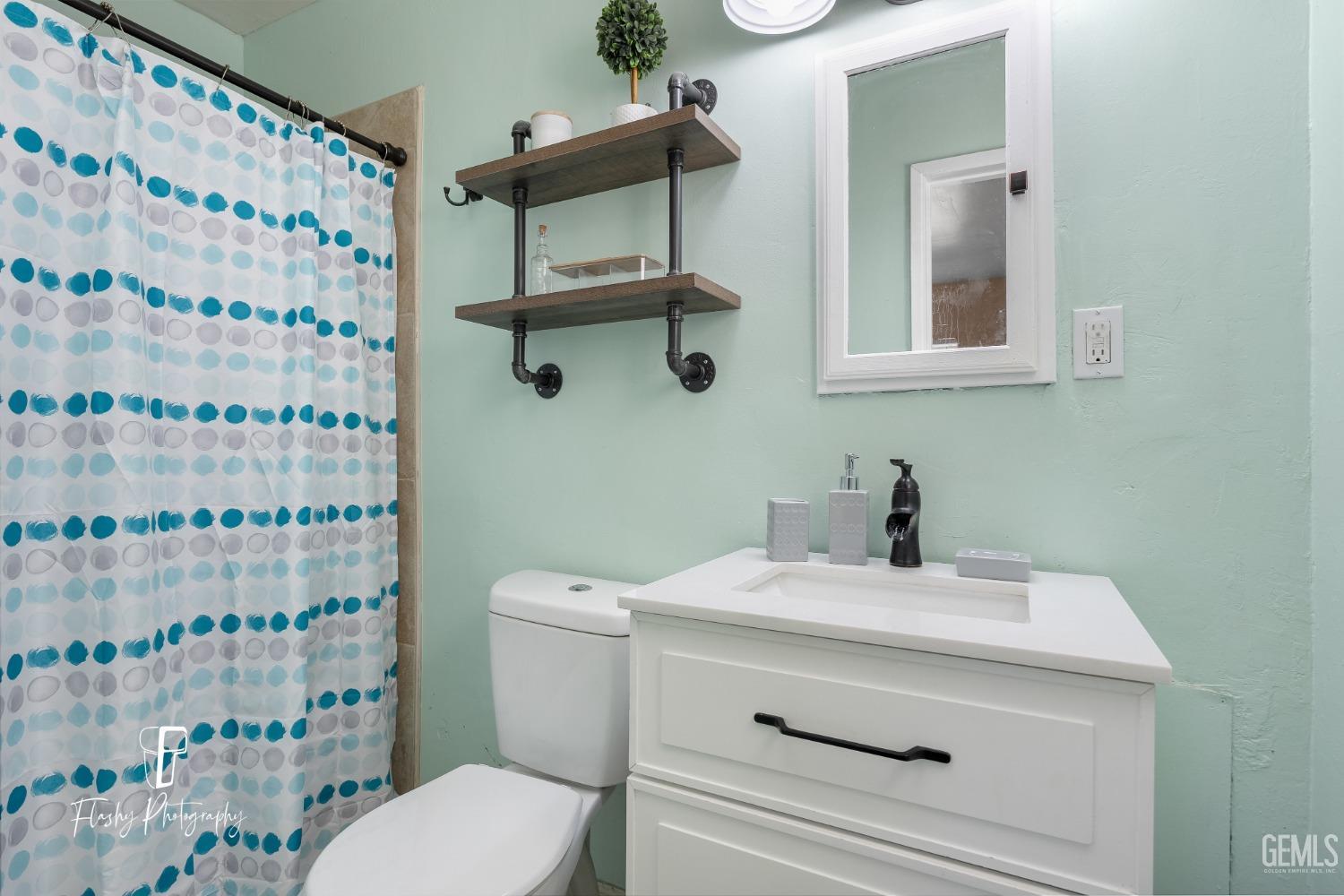 Undisclosed Address Bakersfield, CA 93304 - Photo 17 of 28 a bathroom with a sink toilet and shower