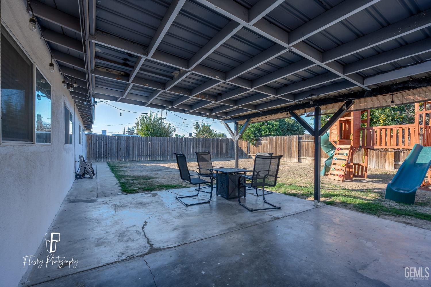 Undisclosed Address Bakersfield, CA 93304 - Photo 26 of 28 a view of house with table and chairs in patio