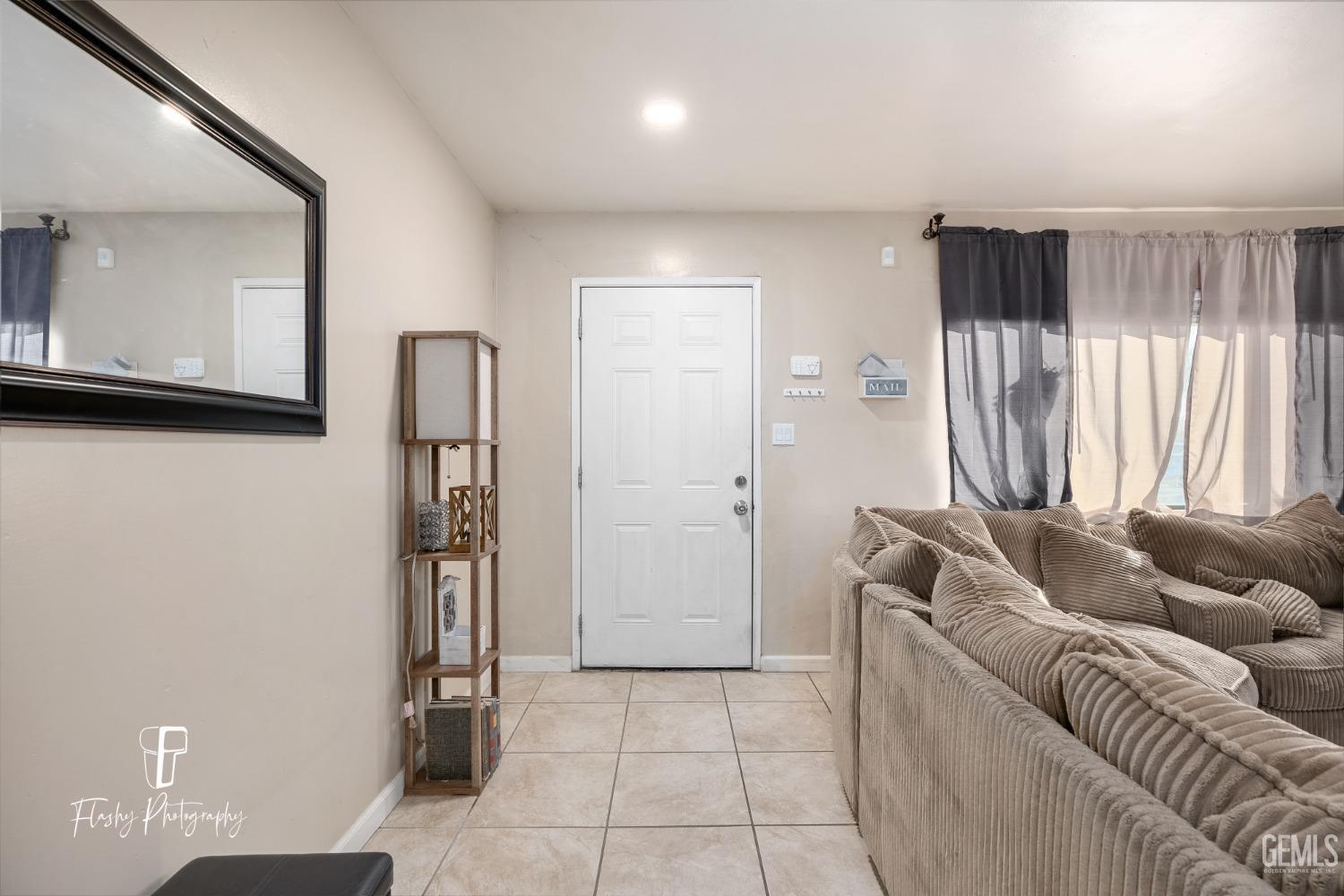 Undisclosed Address Bakersfield, CA 93304 - Photo 5 of 28 a living room with furniture and a window