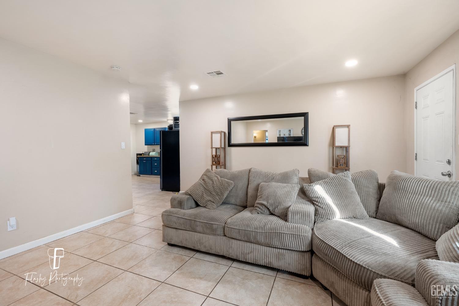 Undisclosed Address Bakersfield, CA 93304 - Photo 7 of 28 a living room with furniture and a couch