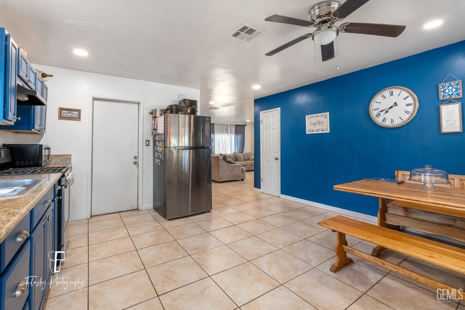 Undisclosed Address Bakersfield, CA 93304 - Photo 9 of 28 a kitchen with stainless steel appliances granite countertop a refrigerator a stove and a sink