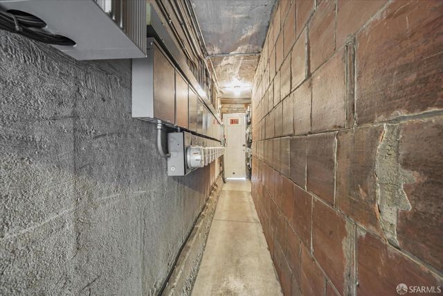 a view of a backyard with chair and potted plants