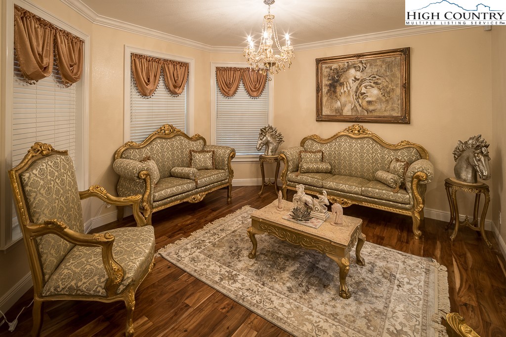 356 Upper Reach Drive Vilas, NC 28692 - Photo 12 of 49 a living room with furniture and a chandelier