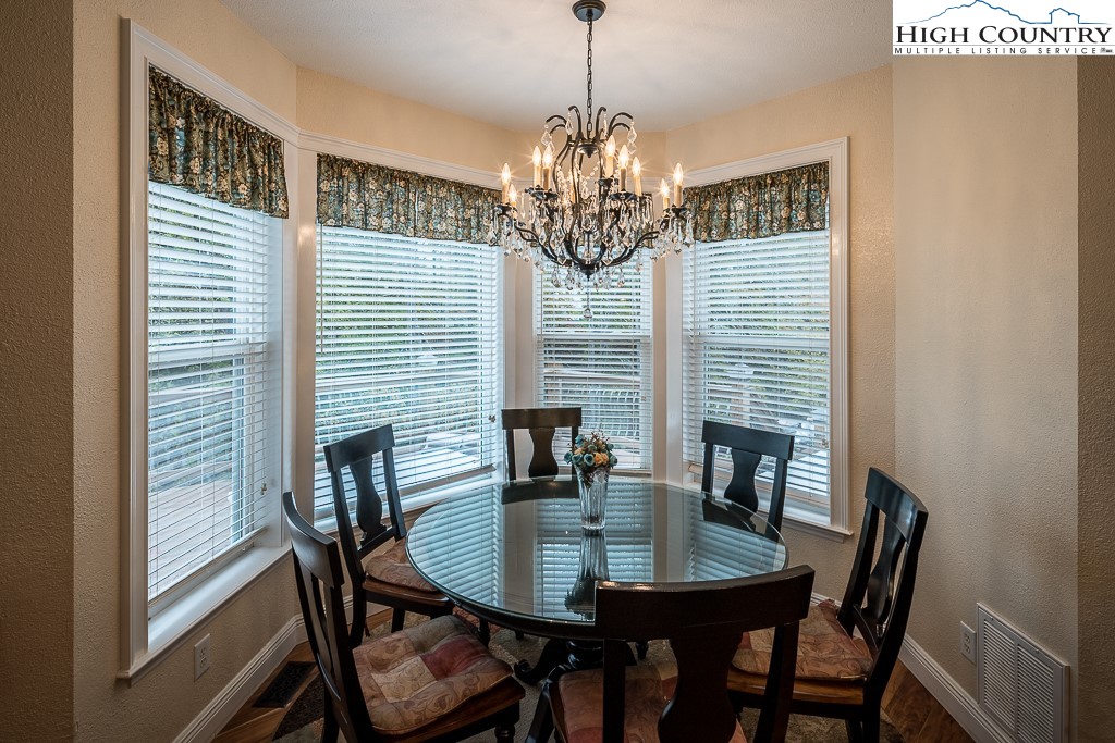 356 Upper Reach Drive Vilas, NC 28692 - Photo 13 of 49 a view of a dining room with furniture and window