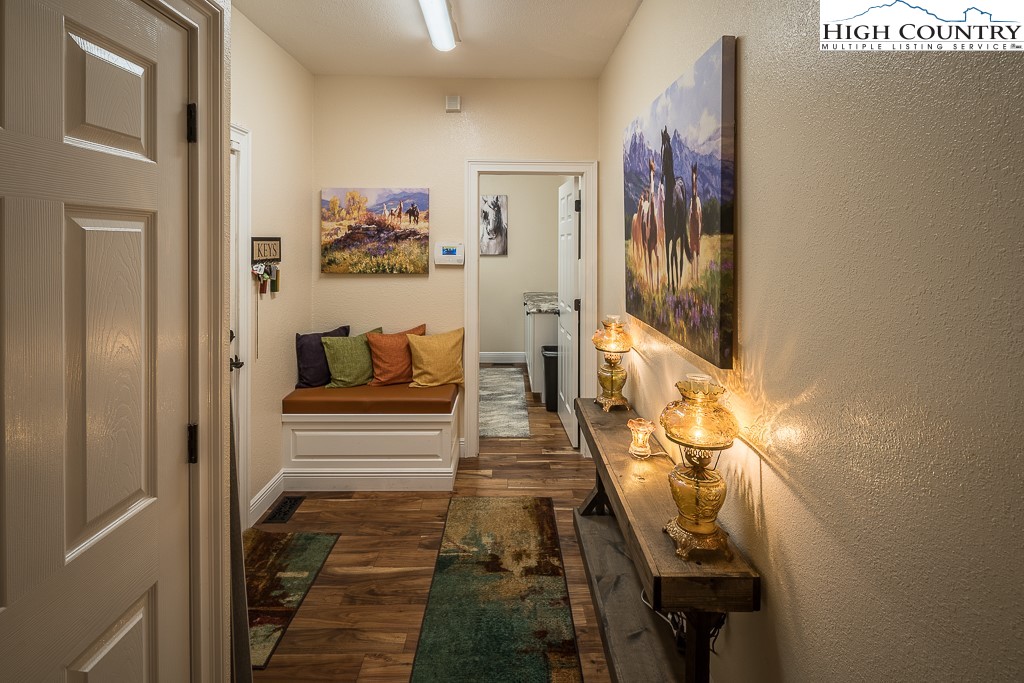 356 Upper Reach Drive Vilas, NC 28692 - Photo 14 of 49 a hallway with painting on the wall and a shower