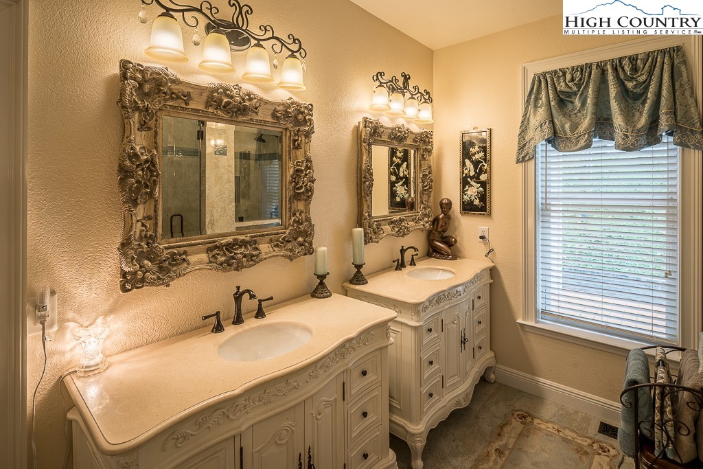 356 Upper Reach Drive Vilas, NC 28692 - Photo 17 of 49 a bathroom with double vanity and a mirror