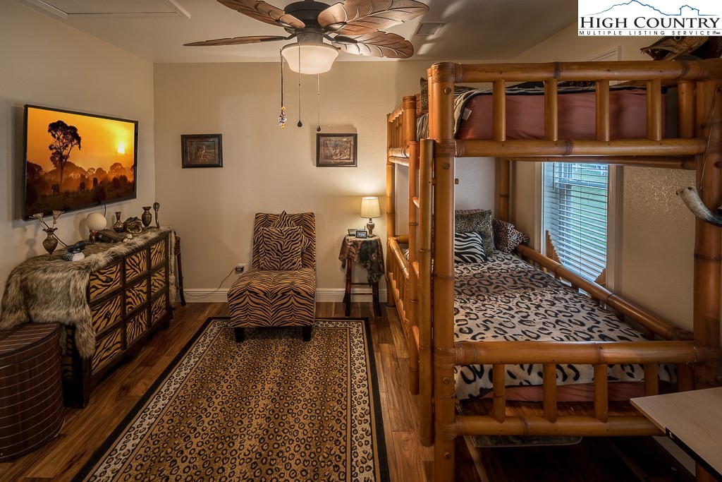 356 Upper Reach Drive Vilas, NC 28692 - Photo 24 of 49 a bedroom with furniture and a window