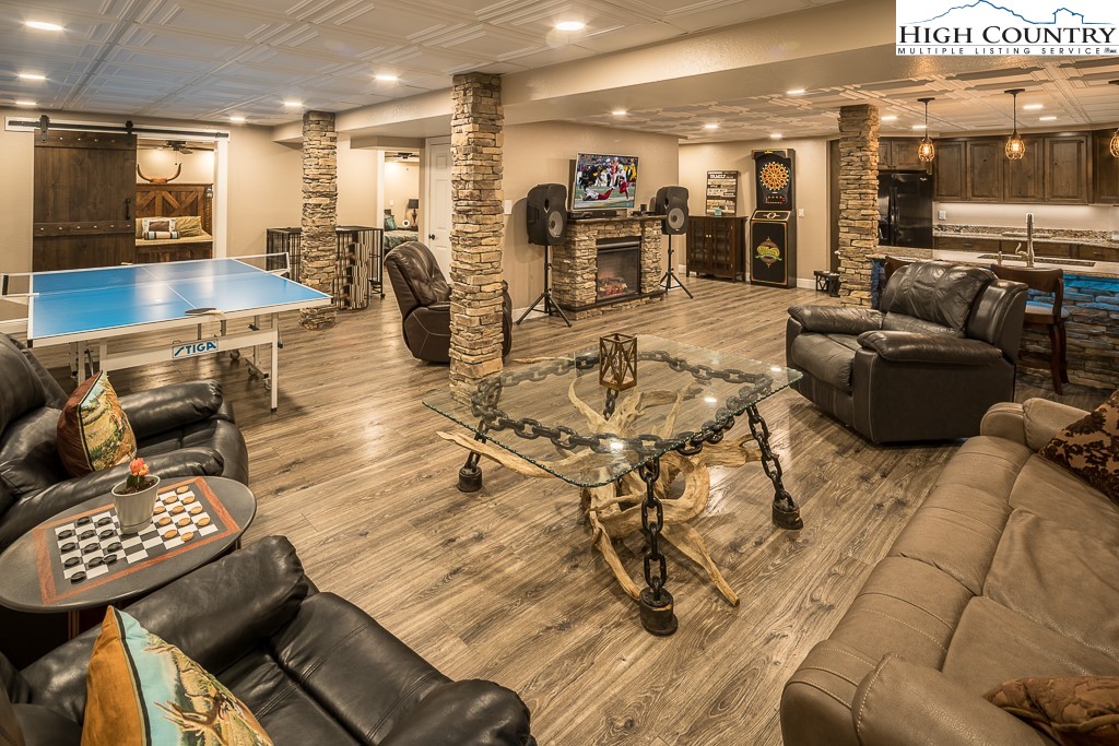 356 Upper Reach Drive Vilas, NC 28692 - Photo 29 of 49 a living room with lots of furniture and wooden floors