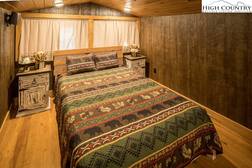 356 Upper Reach Drive Vilas, NC 28692 - Photo 42 of 49 a bedroom with a bed and a window