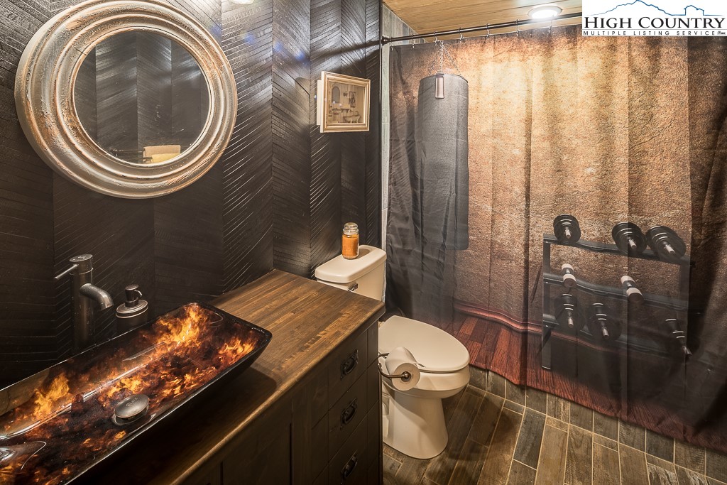 356 Upper Reach Drive Vilas, NC 28692 - Photo 44 of 49 a bathroom with a sink a toilet and shower