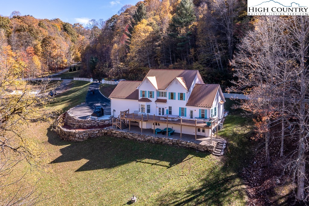 356 Upper Reach Drive Vilas, NC 28692 - Photo 48 of 49 a view of a house with yard swimming pool and a yard