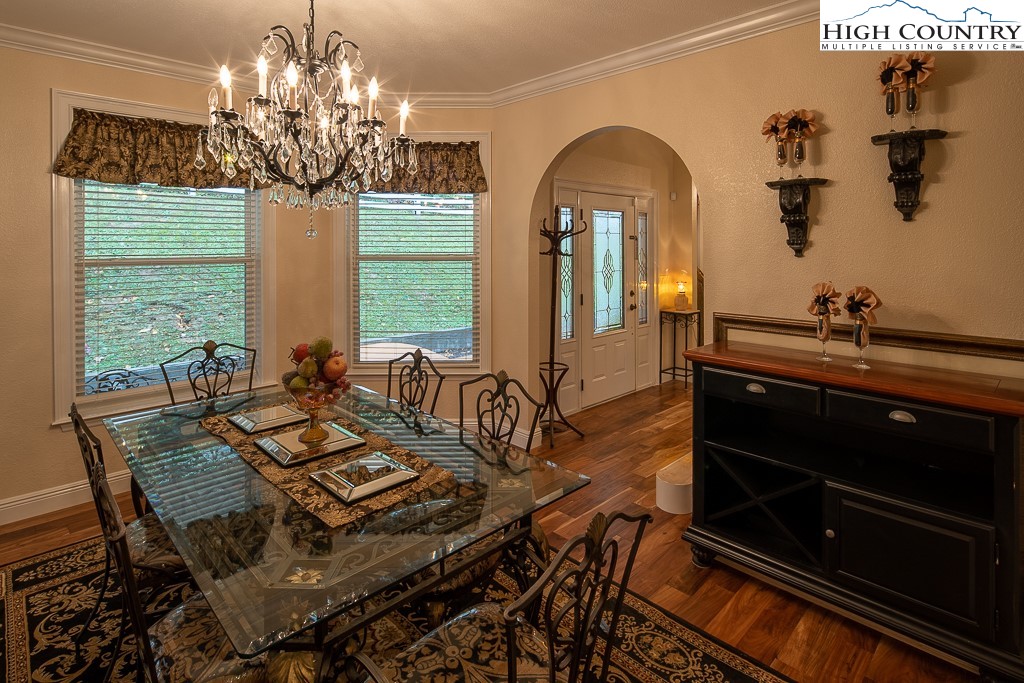 356 Upper Reach Drive Vilas, NC 28692 - Photo 6 of 49 a view of a dining room with furniture and chandelier