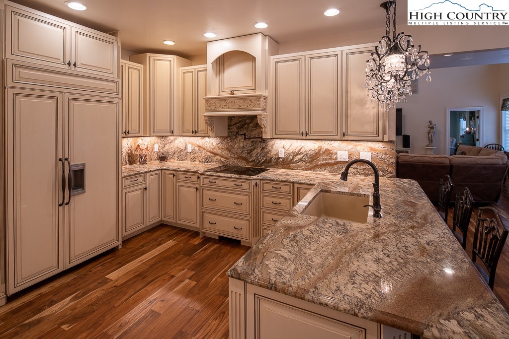 356 Upper Reach Drive Vilas, NC 28692 - Photo 8 of 49 a kitchen with stainless steel appliances granite countertop a sink a stove and a refrigerator