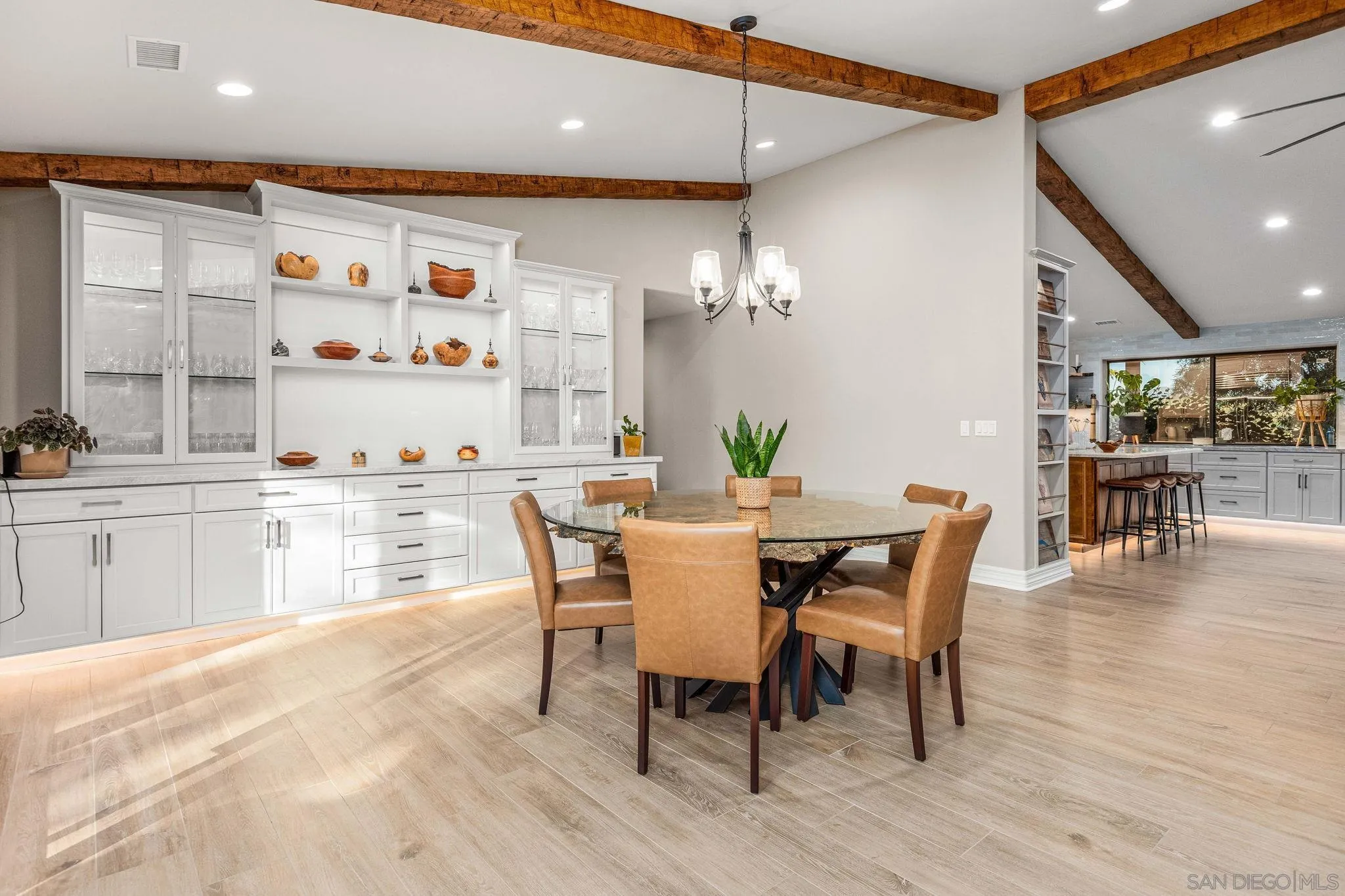 2302 Casitas Del Sol Fallbrook, CA 92028 - Photo 12 of 46 a dining room with furniture and wooden floor
