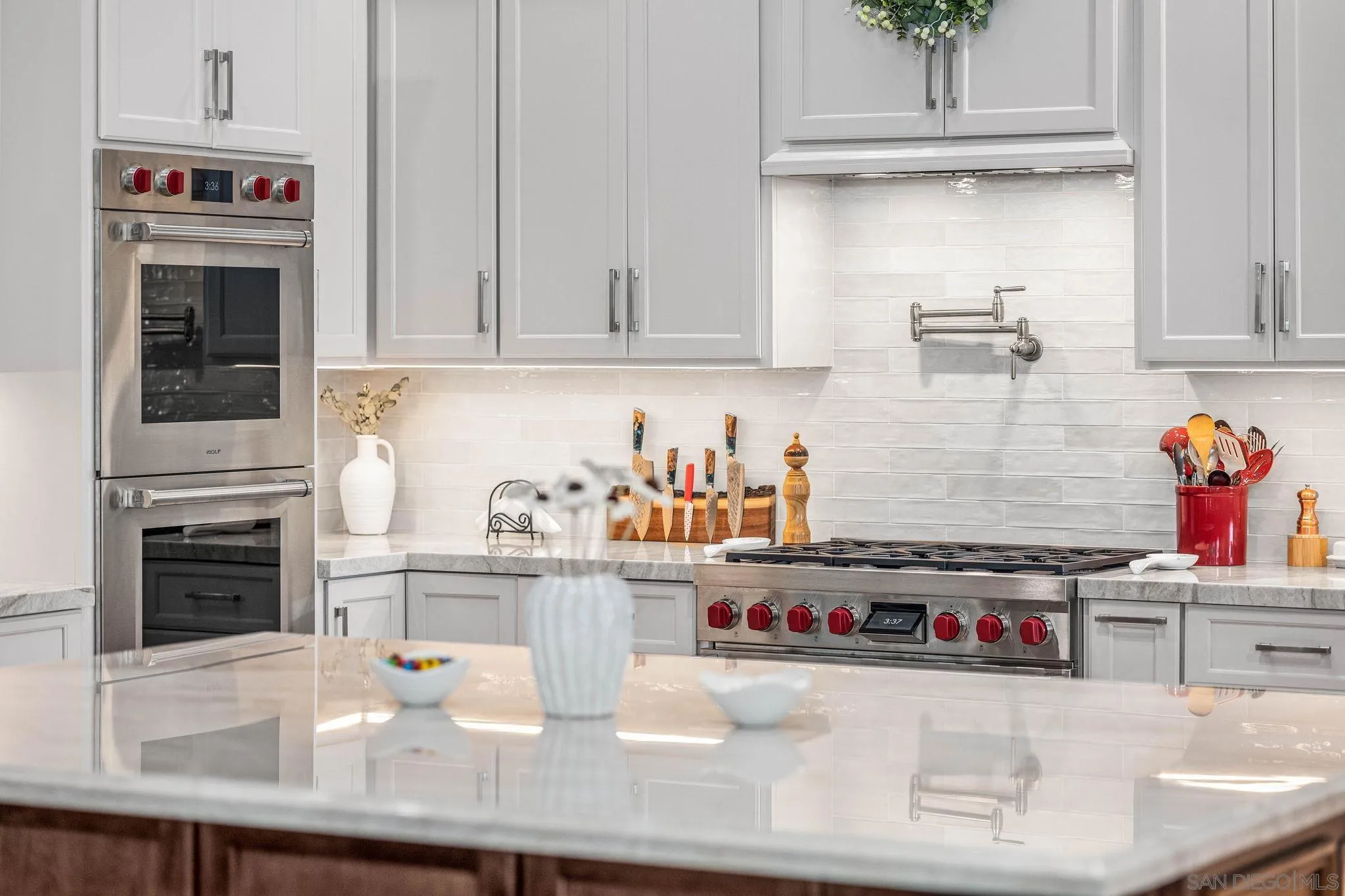 2302 Casitas Del Sol Fallbrook, CA 92028 - Photo 2 of 46 a kitchen with sink a stove and cabinets