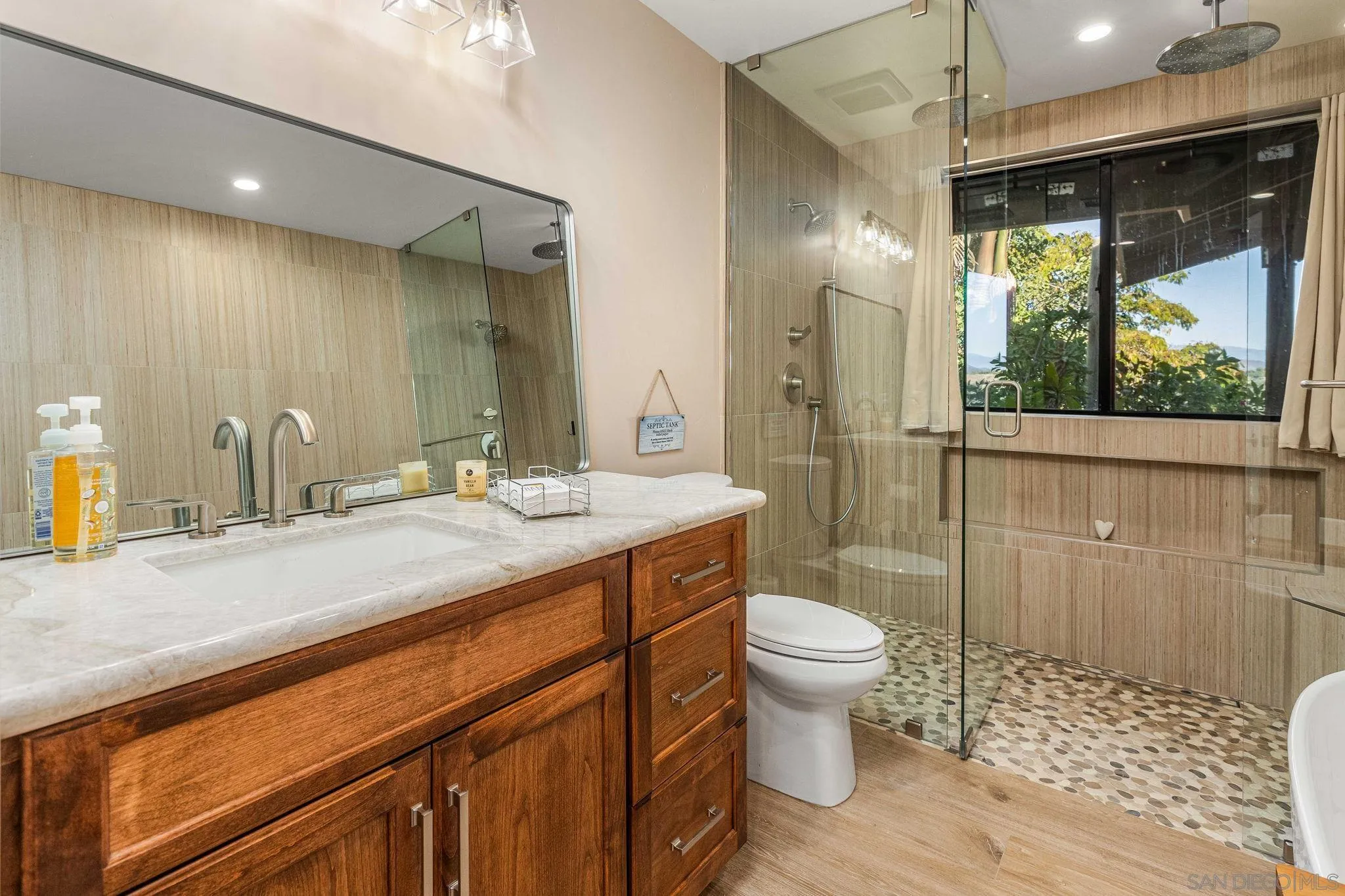 2302 Casitas Del Sol Fallbrook, CA 92028 - Photo 22 of 46 a bathroom with a sink a toilet a mirror and shower
