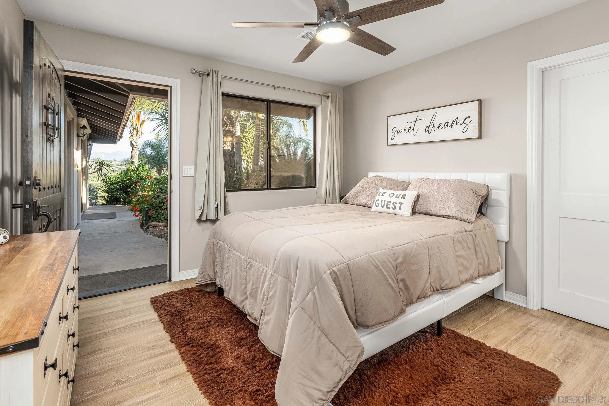 2302 Casitas Del Sol Fallbrook, CA 92028 - Photo 24 of 46 a spacious bedroom with a bed and glass walk in closet