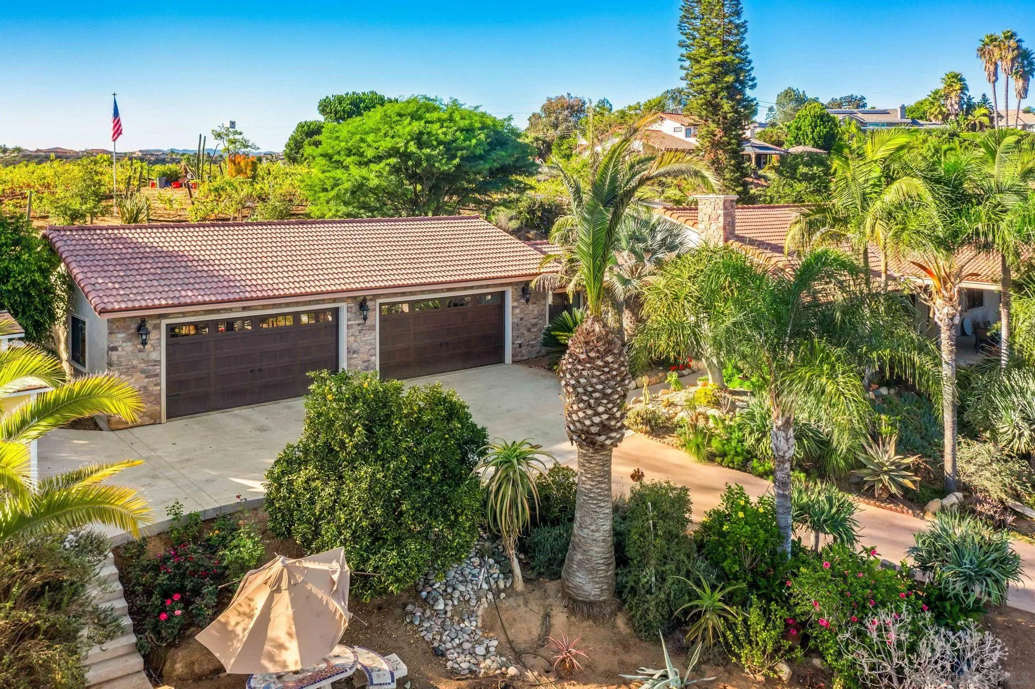 2302 Casitas Del Sol Fallbrook, CA 92028 - Photo 34 of 46 a aerial view of a house with a yard and large trees