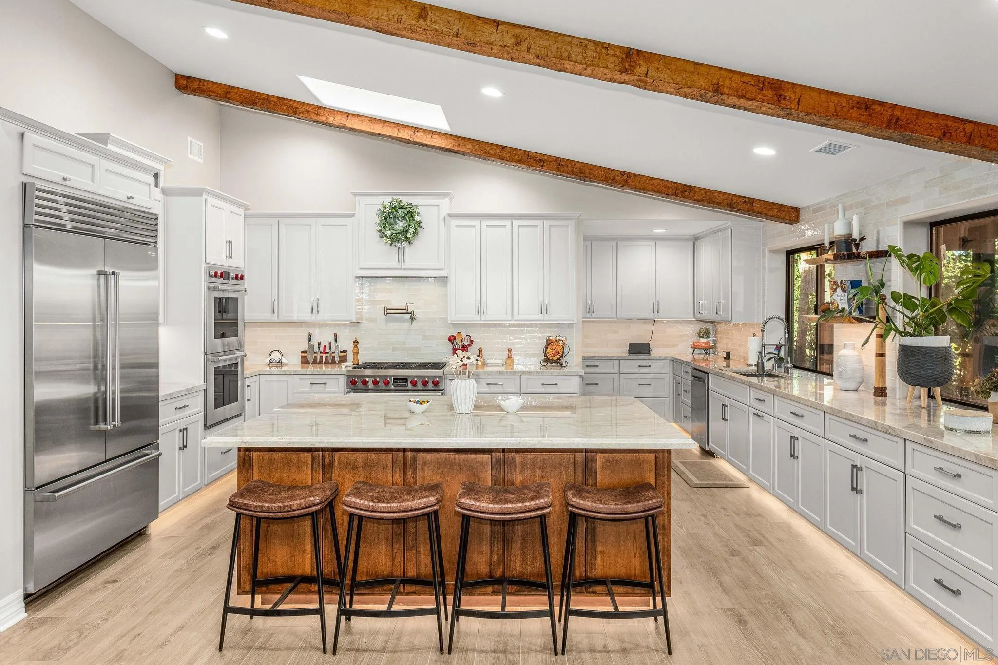 2302 Casitas Del Sol Fallbrook, CA 92028 - Photo 7 of 46 a large kitchen with lots of counter space and stainless steel appliances