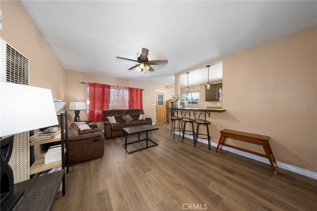 566 South Sage Avenue Rialto, CA 92376 - Photo 9 of 28 a living room with furniture and wooden floor