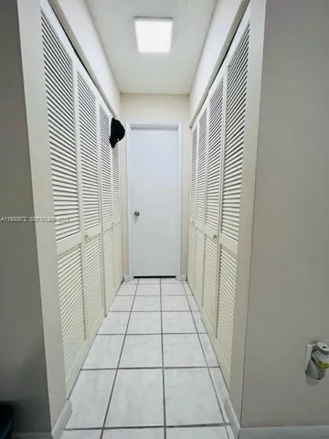 a kitchen with stainless steel appliances a stove a microwave and a counter top space