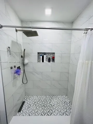 a view of a hallway with stairs