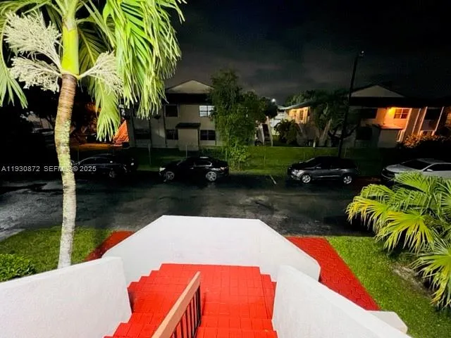 a view of a balcony with a potted plant