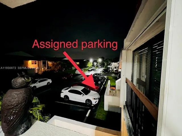 a living room with a black couch and a flat screen tv