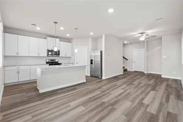 a view of kitchen with wooden floor and window