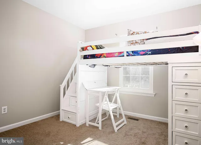 a bathroom with a toilet a sink and vanity