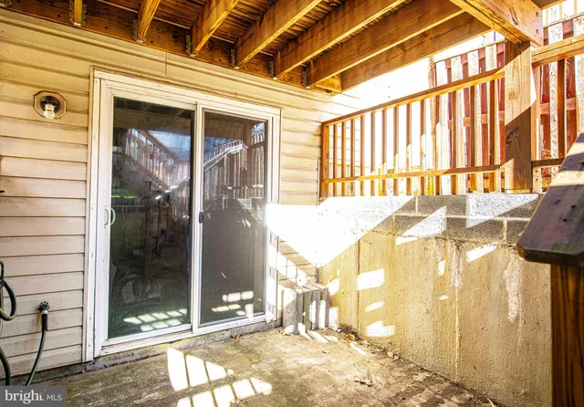 a view of a house with wooden fence