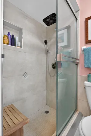 a bathroom with a shower and a toilet