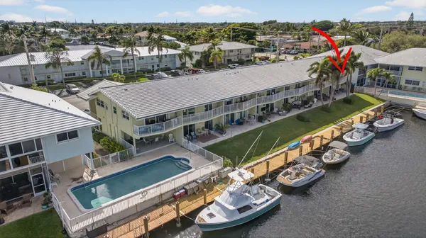 an aerial view of a house with a big yard