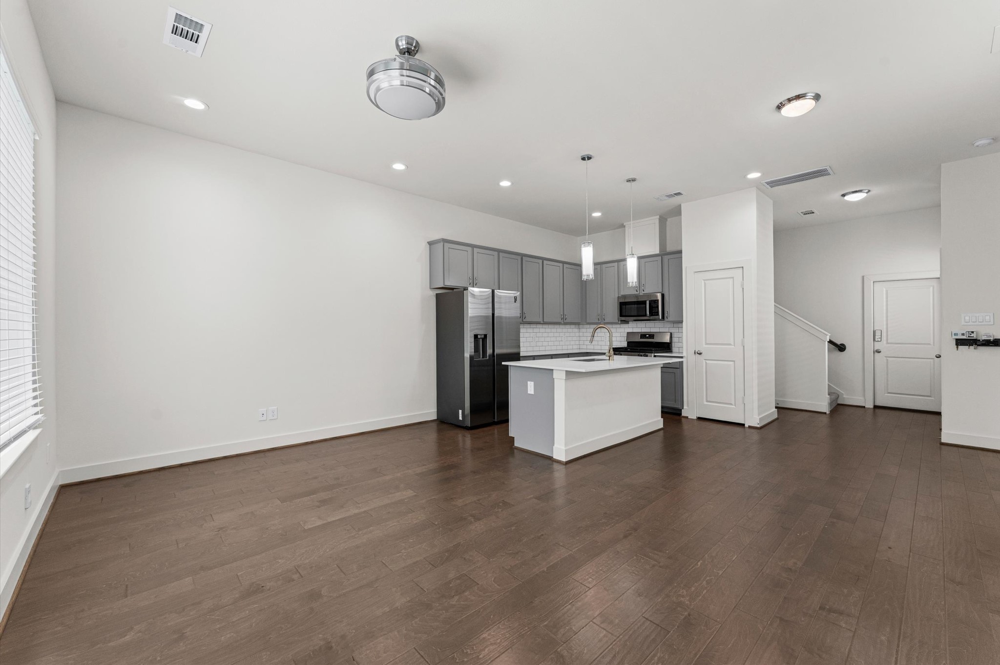 4163 Griggs Road Houston, TX 77021 - Photo 10 of 20 Open-concept first floor combines the kitchen, living, and dining areas — an easy setup for everyday living and entertaining.
