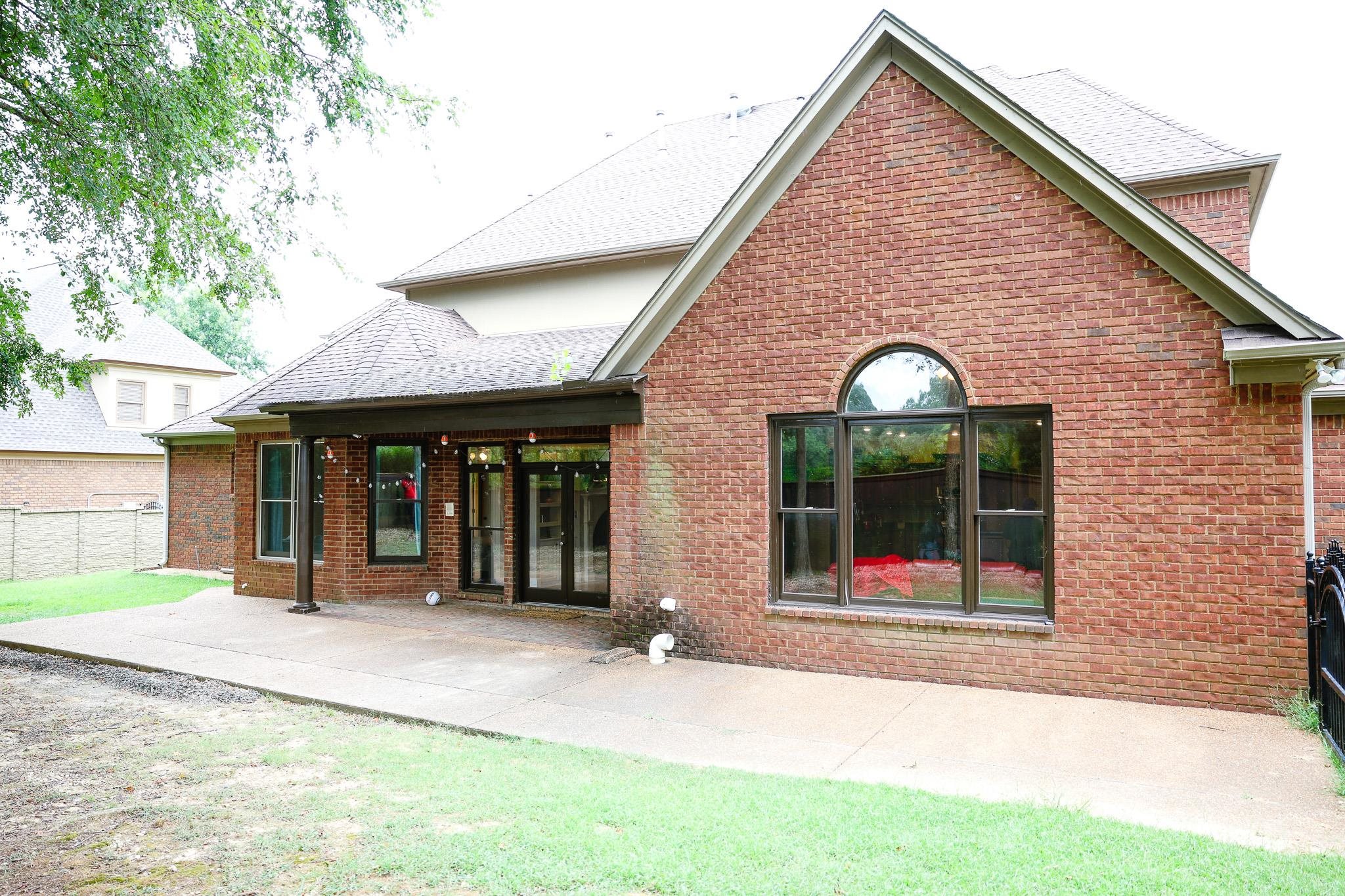 649 Ridge Springs Road Collierville, TN 38017 - Photo 6 of 35 Rear view of house with a patio, a shingled roof, and brick siding