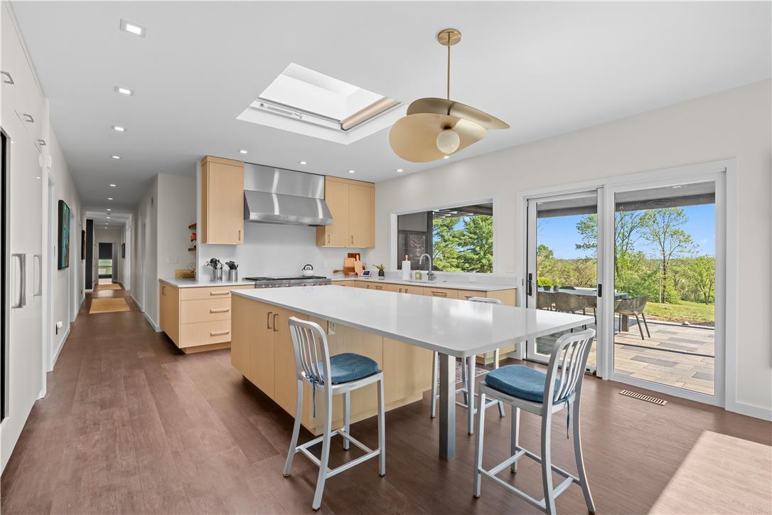 1506 Pleasant View Road Coopersburg, PA 18036 - Photo 25 of 97 Culinary aspirations meet their match in this thoughtfully designed kitchen, complete with an expansive island and a scenic outdoor connection.