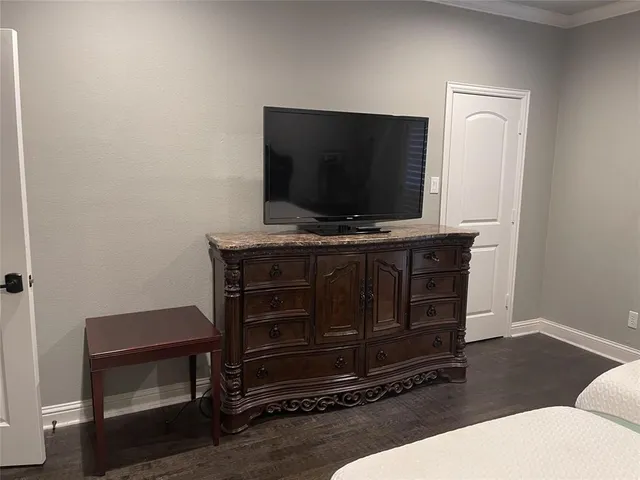 a living room with furniture and flat screen tv