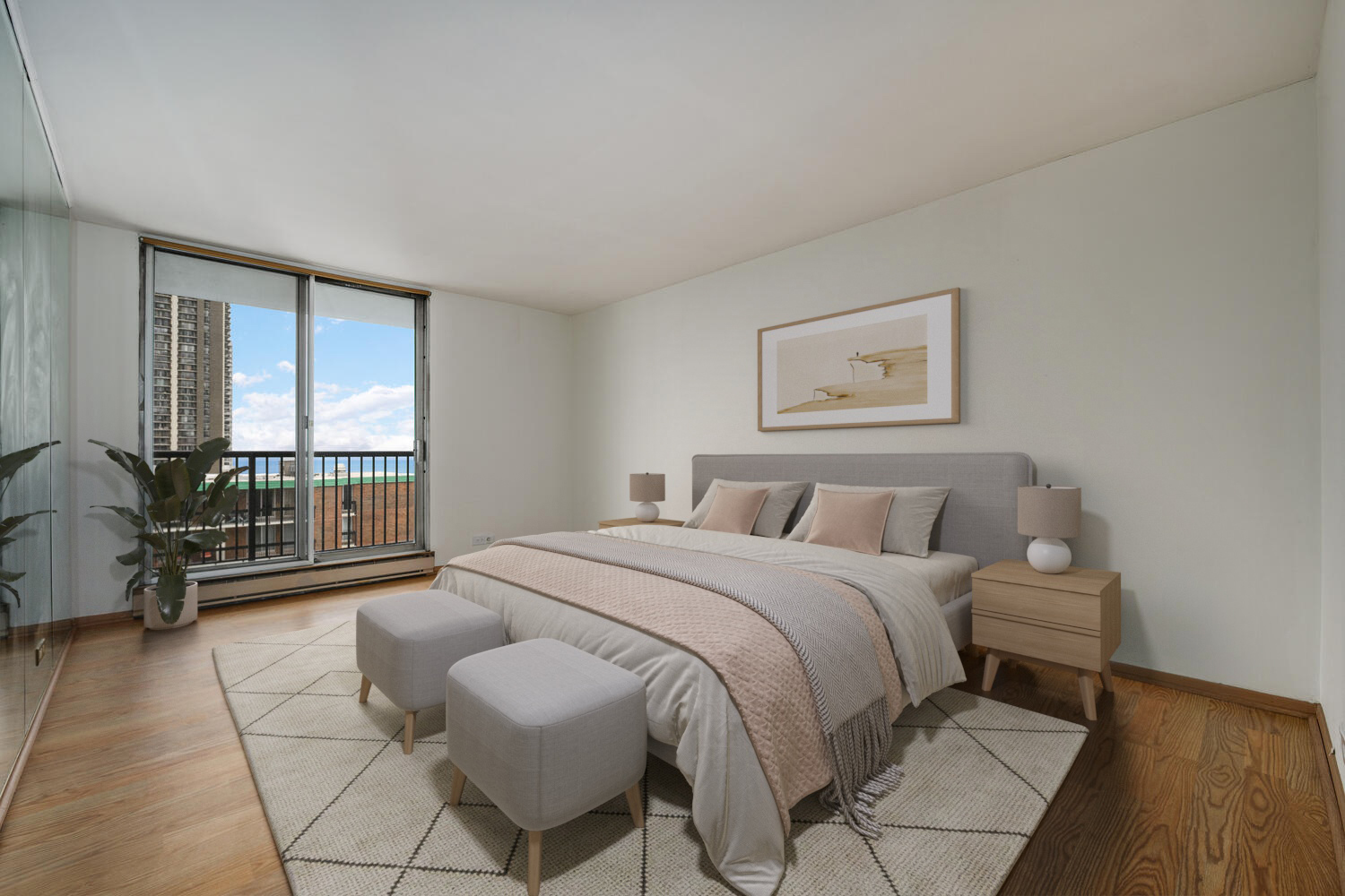 5855 North Sheridan Road, Unit 17D Chicago, IL 60660 - Photo 13 of 18 a spacious bedroom with a bed a couch and large window