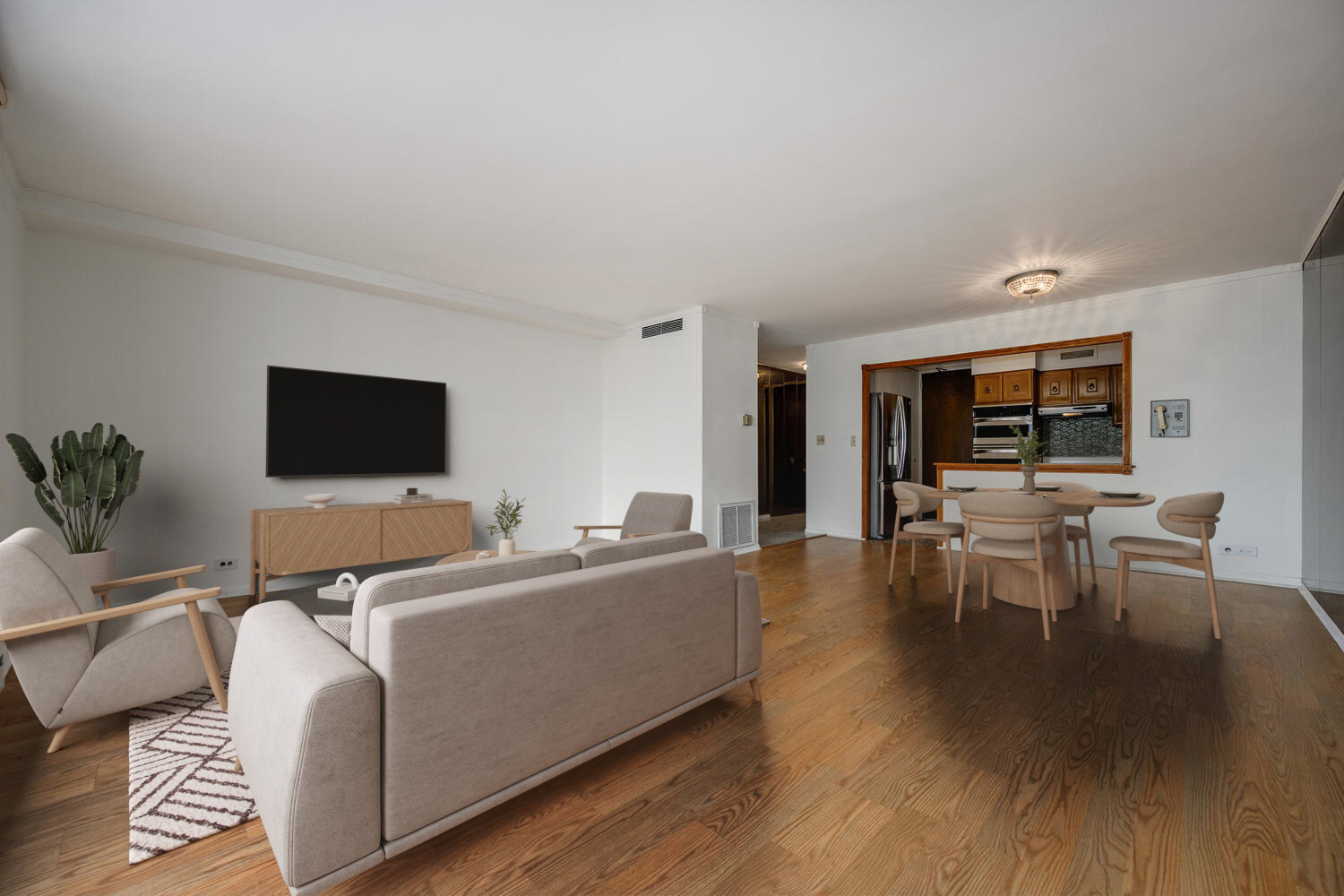 5855 North Sheridan Road, Unit 17D Chicago, IL 60660 - Photo 6 of 18 a living room with furniture and a flat screen tv