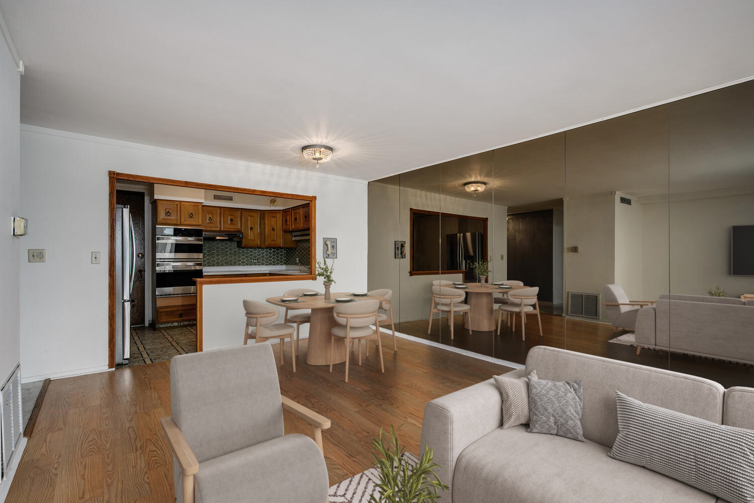 5855 North Sheridan Road, Unit 17D Chicago, IL 60660 - Photo 7 of 18 a living room with furniture kitchen view and a flat screen tv
