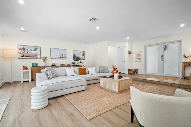 a kitchen with a refrigerator and a stove top oven