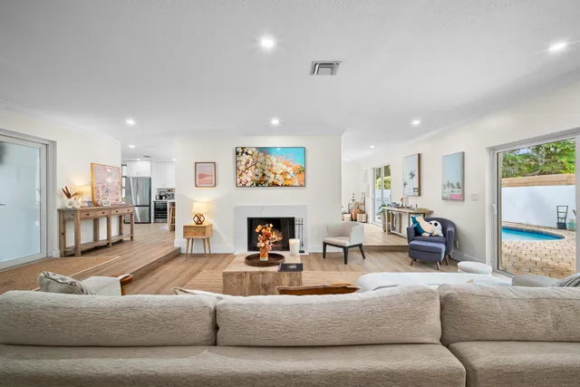 a kitchen with white cabinets and appliances