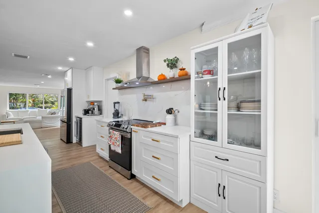 a view of hallway with wooden floor