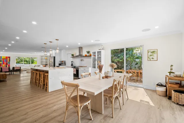 a bedroom with furniture and a flat screen tv