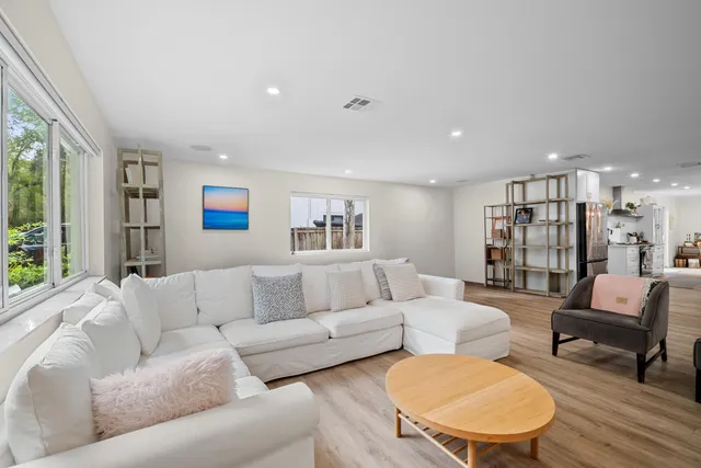 a bedroom with a bed and a couch