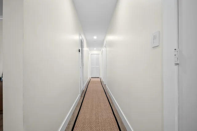 a bathroom with a bath tub and a large window