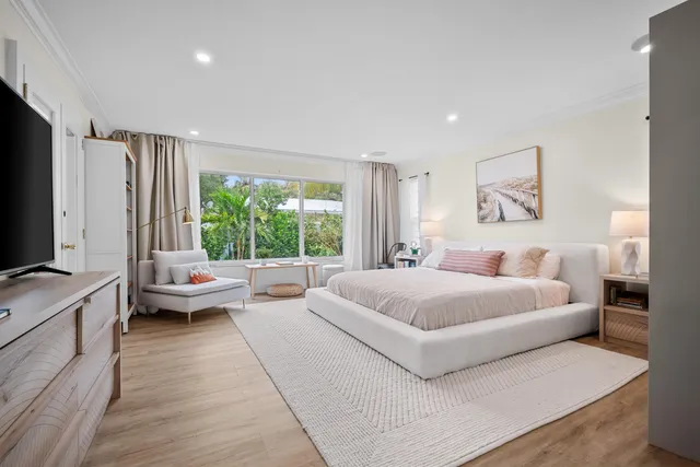 a bedroom with a bed and a desk