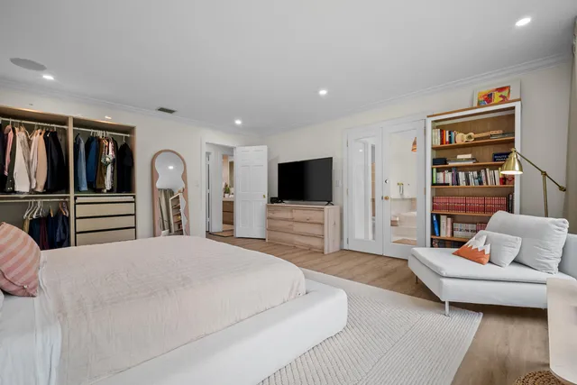 a building outdoor space with patio furniture and garden view