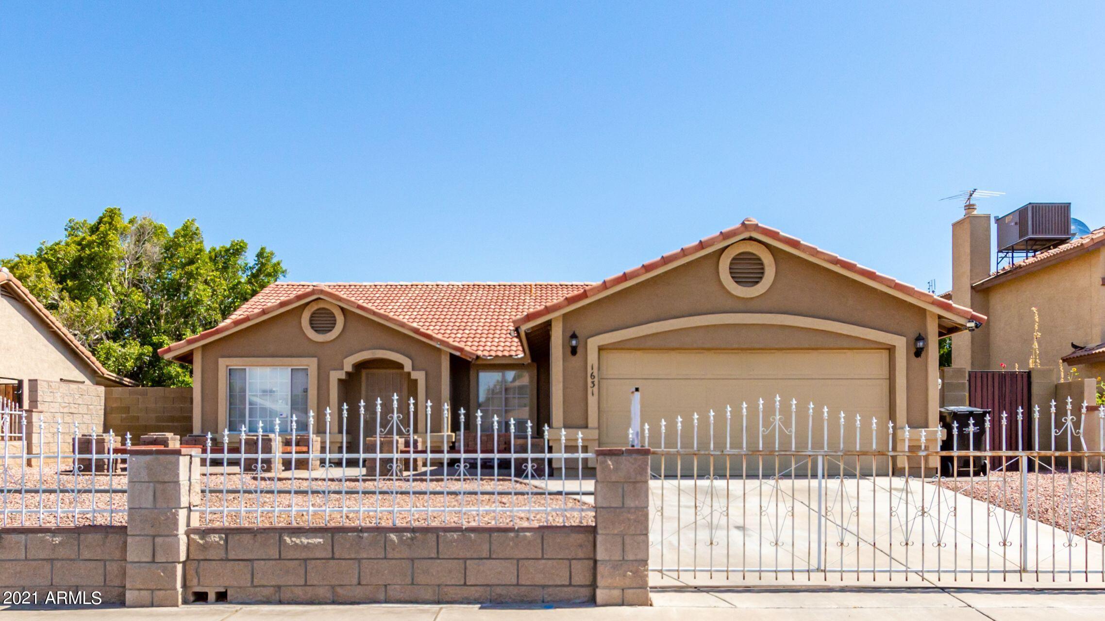 1631 East Vineyard Road Phoenix, AZ 85042 - Photo 1 of 32 FRONT VIEW OF HOME