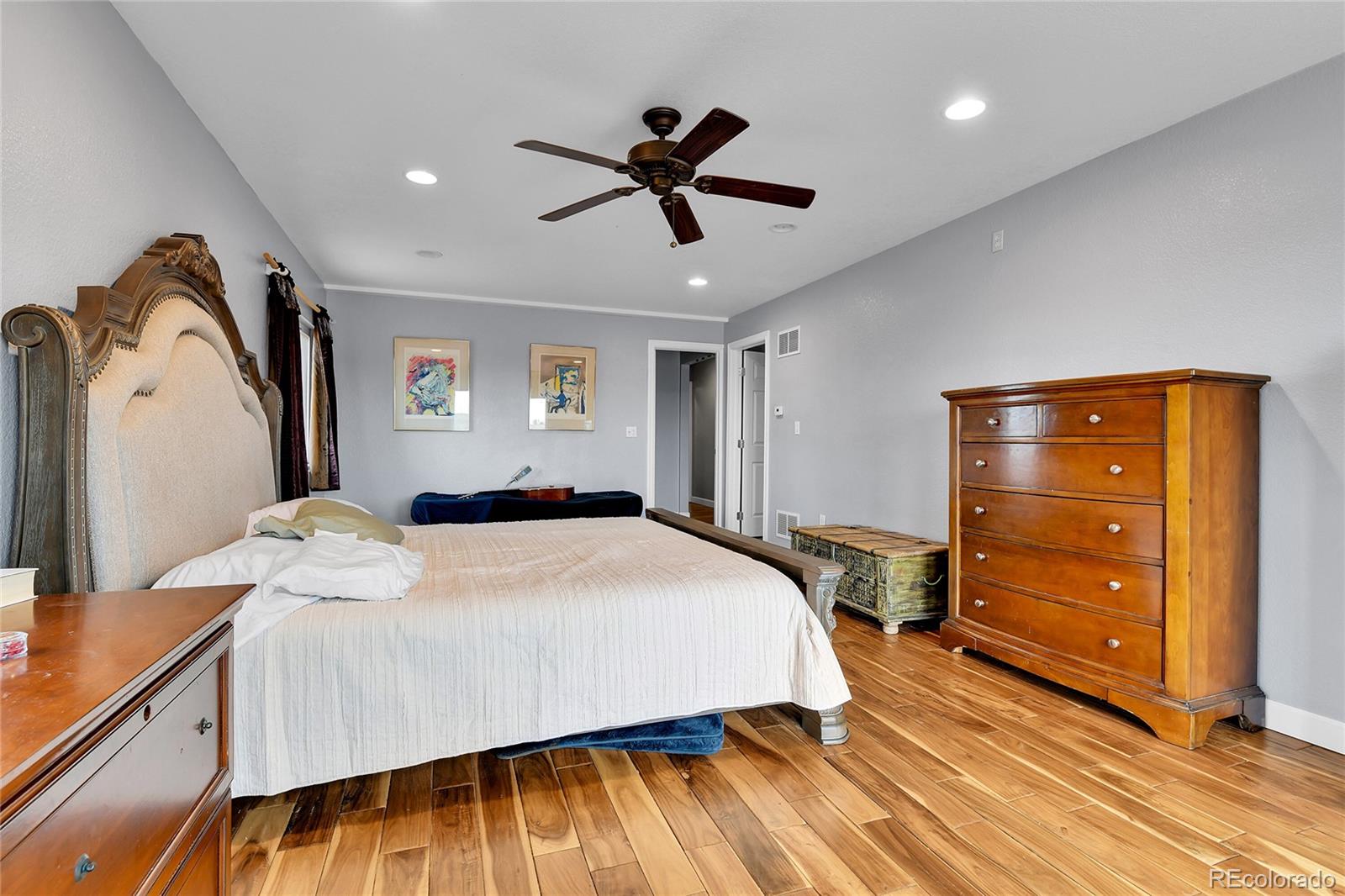 1632 Kiowa-Bennett Road Bennett, CO 80102 - Photo 14 of 42 a bedroom with a bed and a dresser